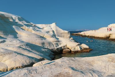 Scenic view of sea against clear blue sky