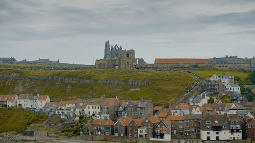 Buildings in city against sky