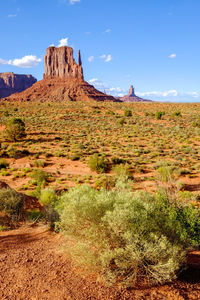 Scenic view of monument valley against blue sky