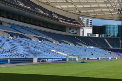 View of soccer field against blue sky