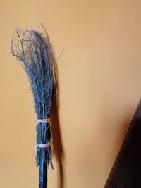 Close-up of witch halloween broomstick against wall