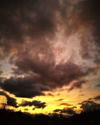 Low angle view of dramatic sky during sunset