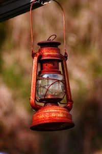 Close-up of red feeder hanging at night