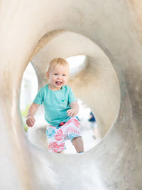 Cropped image of girl playing in bathroom