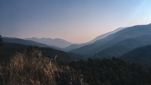 Scenic view of silhouette mountains against sky during sunset