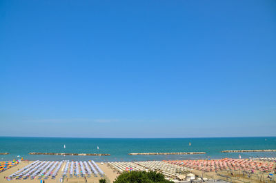 Scenic view of sea against clear blue sky