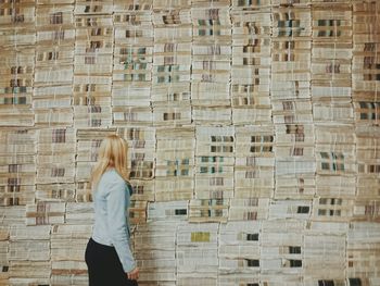 People walking on brick wall