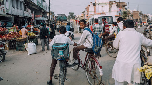 People on street market in city