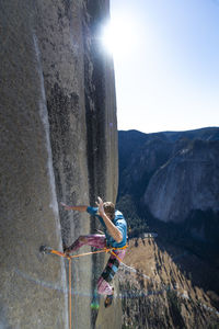 Rock climber falling on big wall while climbing the nose el capitan
