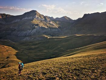 Rear view of man hiking on mountain