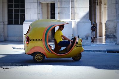 Yellow vintage car on street