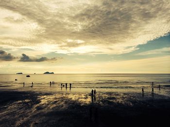 Scenic view of sea against cloudy sky