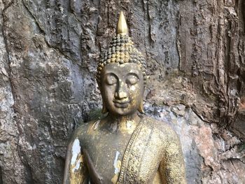 Sculpture of buddha statue outside temple