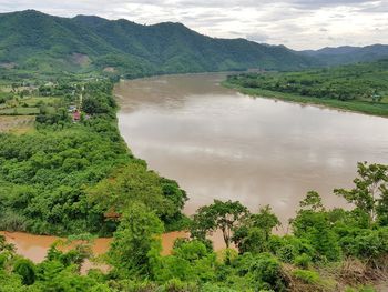 High angle view of trees and mountains against sky