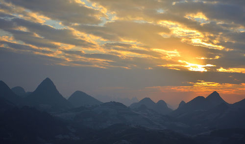 Scenic view of mountains against sky during sunset