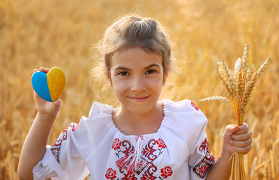 Portrait of young woman holding easter egg