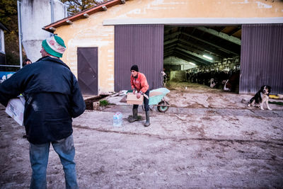 Rear view of people working in city