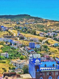 High angle view of townscape against clear blue sky