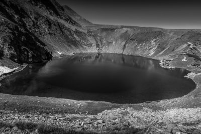 Dramatic black and white the eye, seven rila lakes, bulgaria