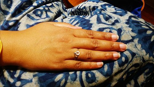 Cropped image of woman showing engagement ring