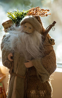 Close-up portrait of figurine at home