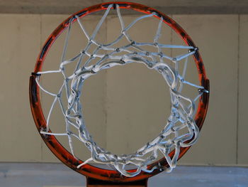 Directly below shot of basketball hoop against wall