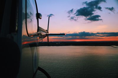 Close-up of sea against sky during sunset