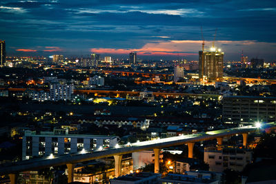 High angle view of illuminated buildings in city at night