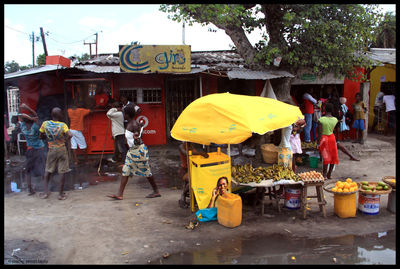 People at market stall in city