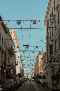 Street amidst buildings against sky