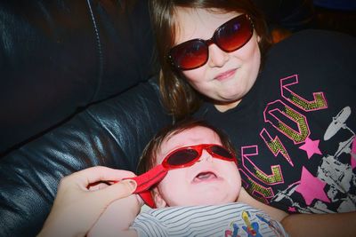 Portrait of happy girl wearing sunglasses