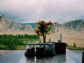 Scenic view of lake against cloudy sky