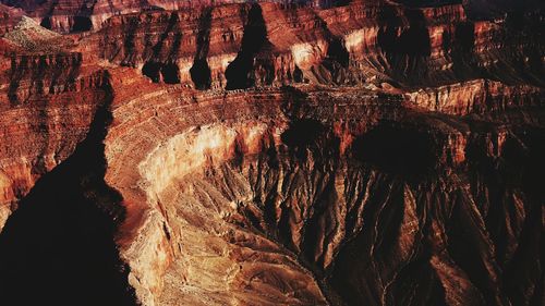 Full frame shot of rock formations at grand canyon national park on sunny day