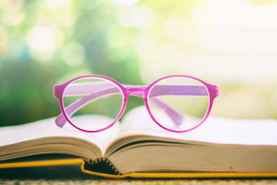 Close-up of eyeglasses on book