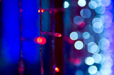 Close-up of illuminated lights at night
