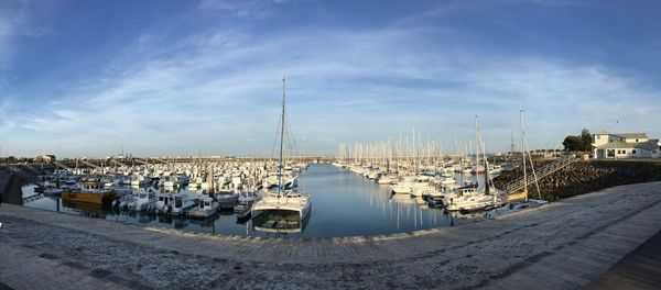 Boats moored at harbor