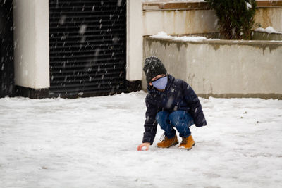 Full length of child in snow