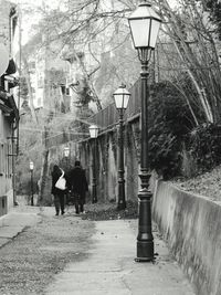 Woman walking on footpath