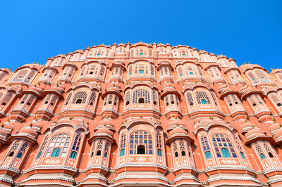 Low angle view of historical building against clear blue sky