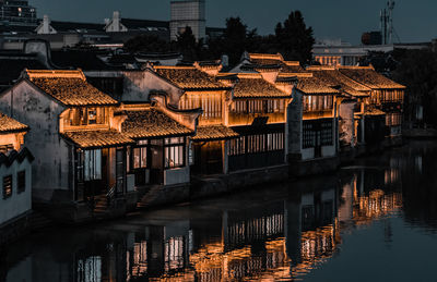 Illuminated buildings in city at night