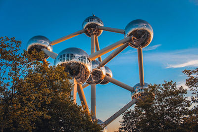 Low angle view of ferris wheel against sky