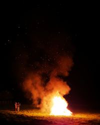 Bonfire against sky at night