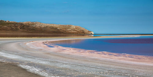 Scenic view of beach against blue sky. koyashskoe lake, crimea