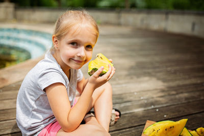 Portrait of boy eating food