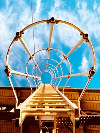 Low angle view of metal structure against sky