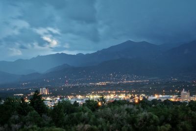 Cityscape with mountain range in background