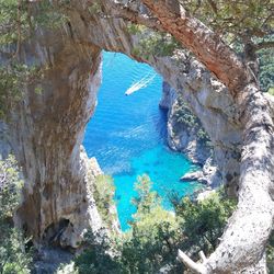 High angle view of sea against blue sky