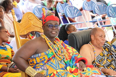 An african king and his elders, siting in a traditional festival 