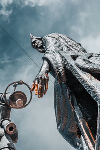 Low angle view of statue against sky