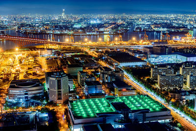 High angle view of illuminated buildings in city at night